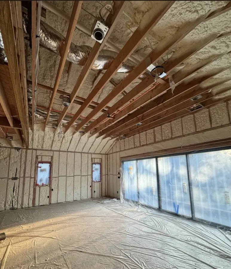 Interior walls and ceiling insulated with spray foam during new construction in Rockdale